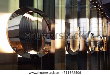 Singapore City, Singapore - April 29th, 2016: Metallic Gucci store sign in The Shoppes at Marina Bay Sands. Gucci is luxury Italian fashion and leather goods brand and part of Gucci Group.