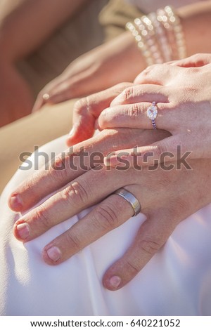 naked girl with hands in lap penis rubbing wet pussy