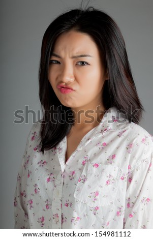 http://thumb9.shutterstock.com/display_pic_with_logo/1729711/154981112/stock-photo-attractive-asian-girl-in-her-twenties-isolated-on-a-plein-background-shot-in-a-studio-154981112.jpg