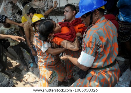 DHAKA, BANGLADESH - APRIL 24, 2013: Rescue workers try rescue trapped garment workers in the Rana plaza building which collapsed in Saver near Dhaka, Bangladesh on April 24, 2013.