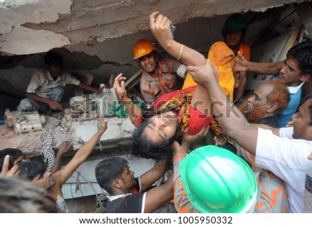 DHAKA, BANGLADESH - APRIL 24, 2013: Rescue workers try rescue trapped garment workers in the Rana plaza building which collapsed in Saver near Dhaka, Bangladesh on April 24, 2013.