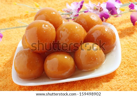 sweet balls called gulab jamun an indian sweet in a dish - stock photo