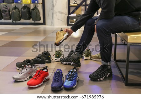 Nike store. Man buys sneakers Nike Air Max - Ukraine, Kiev - June 20, 2017