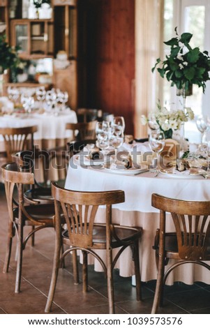 Decorated Wedding Table In Rustic Style For Dinner With White And Beige Tablecloths Wine Glasses Decorated Wedding Table In Rustic Style For Dinner With White And Beige Tablecloths Wine Glasses