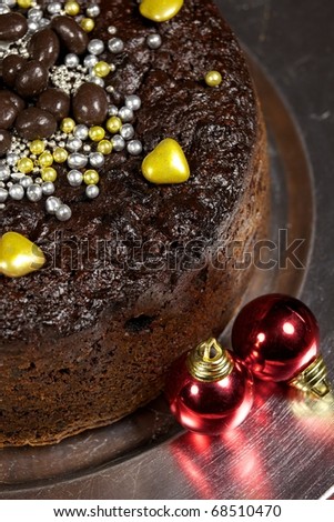 Decorated Christmas cake with baubles