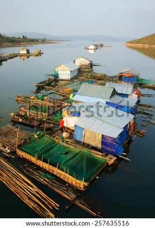 DAKLAK, VIET NAM- FEB 26: Asian residence on water, group of floating house of fishing village, beautiful Vietnamese countryside, impression panoramic, Dak Lak, Vietnam, Feb 26, 2015