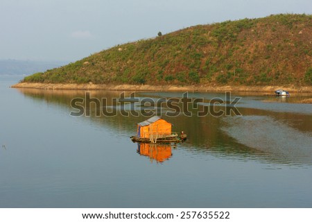 DAKLAK, VIET NAM- FEB 26: Asian residence on water, group of floating house of fishing village, beautiful Vietnamese countryside, impression panoramic, Dak Lak, Vietnam, Feb 26, 2015