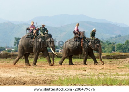 BUON ME THUOT- VIET NAM- JUNE 11: Asia travel in summer vacation at beautiful Vietnamese countryside, traveler travelling by ride elephant in eco tour, green landscape of rural, Vietnam, June 11, 2015