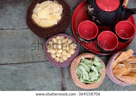 Vietnamese food for Tet holiday in spring, jam is traditional food on lunar new year, can make from sweet potato, lotus seed, ginger with sugar, colorful background for Vietnam custom