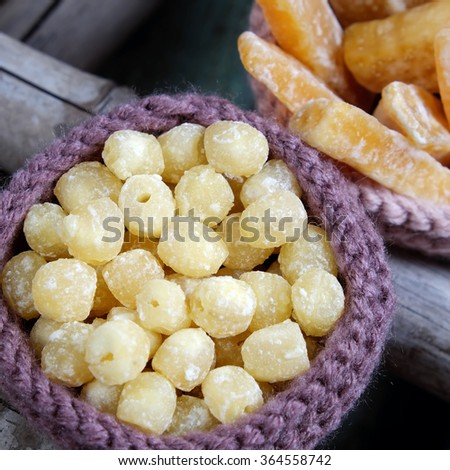 Vietnamese food for Tet holiday in spring, jam is traditional food on lunar new year, can make from sweet potato, lotus seed, ginger with sugar, colorful background for Vietnam custom
