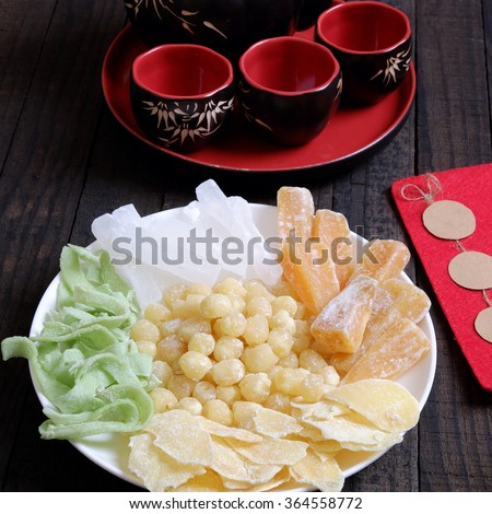 Vietnamese food for Tet holiday in spring, jam is traditional food on lunar new year, can make from sweet potato, lotus seed, ginger with sugar, colorful background for Vietnam custom