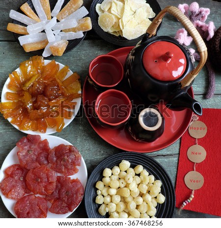 Amazing of Vietnamese food for Tet holiday in spring, jam is traditional food on lunar new year, make from sweet potato, lotus seed, ginger, mango with sugar, colorful background for Vietnam culture