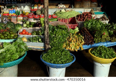 CA MAU, VIET NAM- JULY 15, 2016: Roadside food stalls at Mekong Delta countryside, farmer market sell green vegetable from agriculture product, Camau, Vietnam