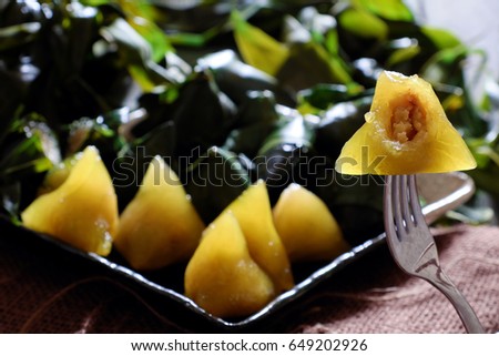 Vietnamese traditional food for may 5th, is double five festival or tet doan ngo, sticky rice cake in green leaf, also call banh u tro with pyramidal shape