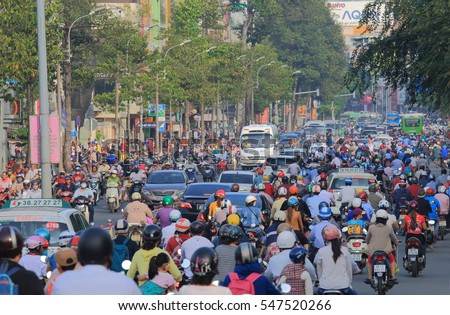 HO CHI MINH CITY VIETNAM - DECEMBER 1, 2016: Unidentified people commute in downtown Ho Chi Minh City.