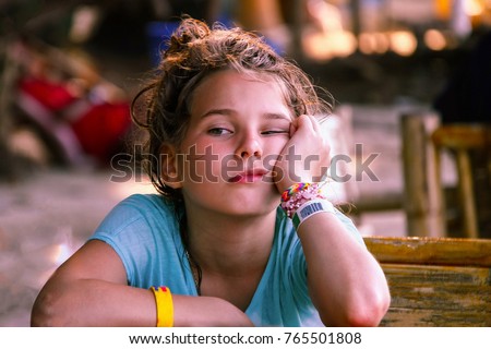 https://thumb9.shutterstock.com/display_pic_with_logo/179369396/765501808/stock-photo-a-european-looking-girl-with-a-face-expressing-boredom-and-anticipation-asian-cafe-travel-with-765501808.jpg