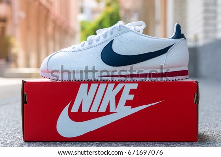 BANGKOK, THAILAND - JULY 2, 2017:Nike classic cortez white/midnight navy/gym-red with box. Nike, Inc. is an American multinational corporation that designs, develops, manufactures and sells.