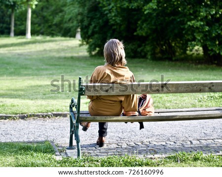 Girl Sitting Alone On Bench Stock Photo 142835383 - Shutterstock