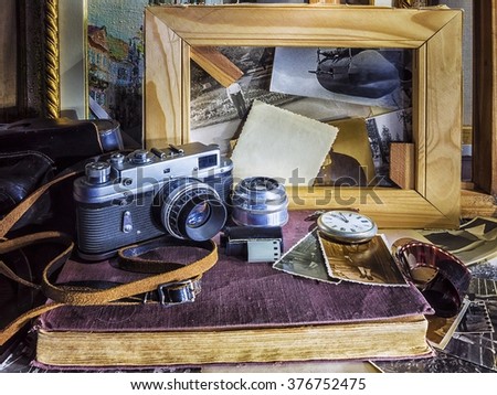 Composition Of Vintage Objects On The Background Old Photographs And Wooden Frames For Paintings Composition Of Vintage Objects On The Background Old Photographs And Wooden Frames For Paintings