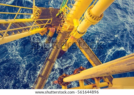 Offshore drill yellow and gas production petroleum pipeline waves sea.