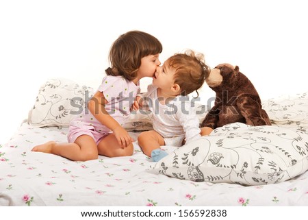 a girl and a boy kissing in bed a girl and a boy kissing in bed