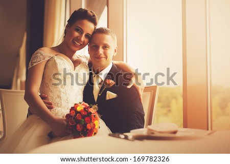 http://thumb9.shutterstock.com/display_pic_with_logo/1868738/169782326/stock-photo-sensual-happy-married-couple-in-restaurant-169782326.jpg
