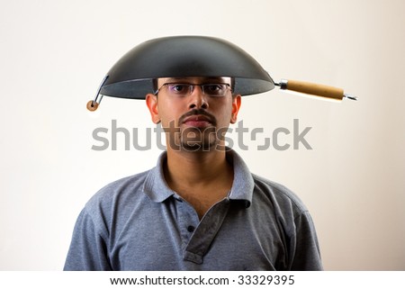 stock-photo-man-with-wok-on-head-isolated-on-white-33329395.jpg