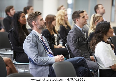 Audience Listening To  Speaker At Conference Presentation