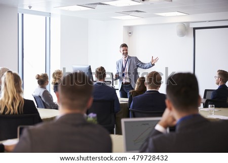 Businessman Making Presentation At Conference