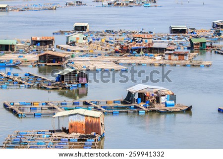 Float fishing village, Long Son, Long Hai, Ba Ria- Vung Tau Vietnam. People living and doing feed fish industry at floating village.