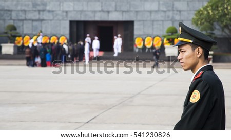 Hanoi, Vietnam - Dec 17, 2016: Vietnamese security police officer guarding in front of the tomb of late president Ho Chi Minh (Uncle Ho) in Hanoi capital.
