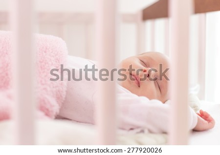 beautiful newborn sleep in crib
