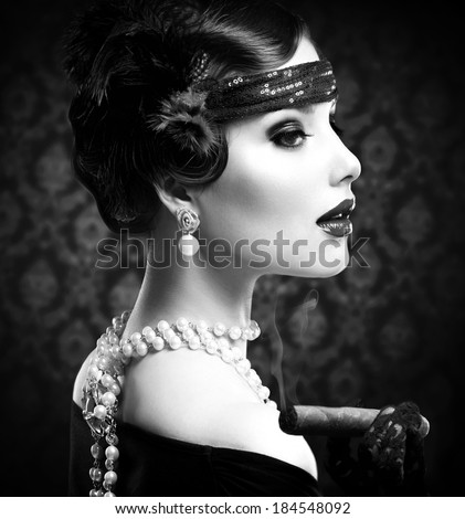 Retro Woman Portrait. Vintage Styled Girl With Cigar. Smoking Lady. Vintage Styled Black and White Photo. Old Fashioned Makeup and Finger Wave Hairstyle. 20's or 30's style.