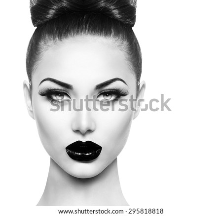 High fashion beauty model girl face close up with black make up and long lushes High fashion beauty model girl face close up with black make up and long lushes