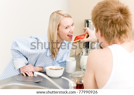 https://thumb9.shutterstock.com/display_pic_with_logo/206023/206023,1306394050,2/stock-photo-breakfast-happy-couple-man-feed-toast-to-woman-in-kitchen-77990926.jpg