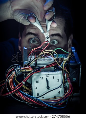 stock-photo-anxiously-bomb-man-afraid-of-the-tnt-disarming-the-bomb-side-cutter-cutting-the-red-wire-274708556.jpg