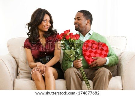 http://thumb9.shutterstock.com/display_pic_with_logo/2084267/174877682/stock-photo-valentine-man-has-romantic-gifts-for-woman-174877682.jpg