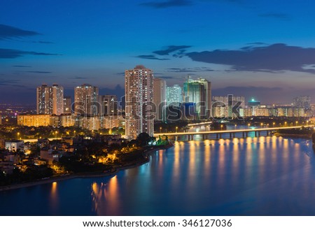 Aerial view of Hanoi skyline cityscape at twilight period. Linh Dam lake, south of Hanoi capital
