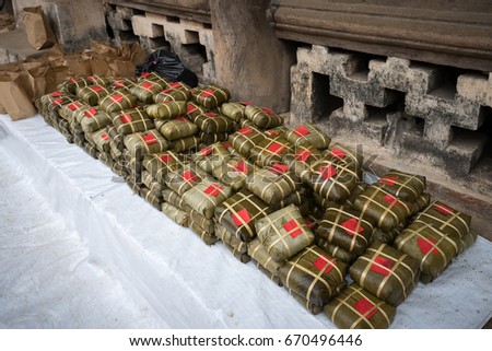 Pile of Chung cakes, Cooked square glutinous rice cake, Vietnamese new year food. Vintage background