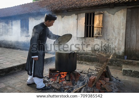 Hanoi, Vietnam - Jun 22, 2017: Cooking Chung cake outdoor in communal house at So village, Quoc Oai district. Square glutinous rice cake, Vietnamese lunar new year food