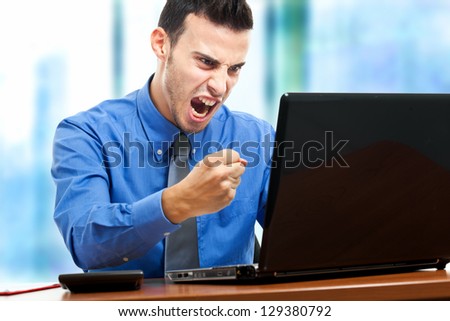 stock-photo-angry-businessman-against-his-computer-129380792.jpg