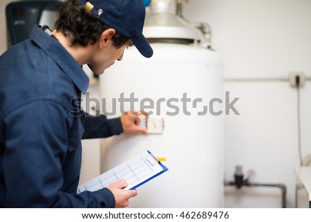 Plumber repairing an hot-water heater