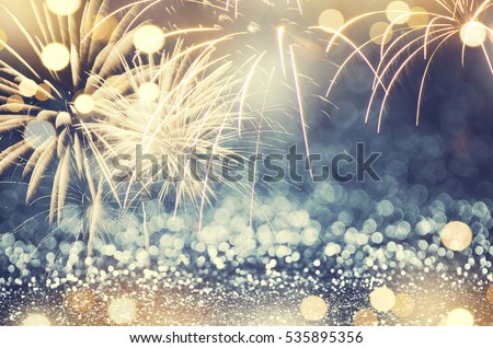 Gold and green Fireworks and bokeh in New Year eve and copy space. Abstract background holiday.