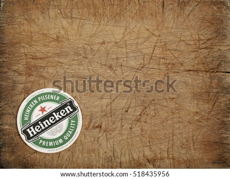 AMSTERDAM, HOLLAND - April 24, 2016.: Beer mats from Heineken Lager Beer in vintage background , it was first brewed by Gerard Adriaan Heineken in 1873