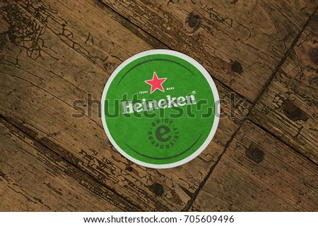 AMELAND, DUTCH - 26 AUGUST 2017.: Beer mat HEINEKEN, it was first brewed by Gerard Adriaan Heineken in 1873