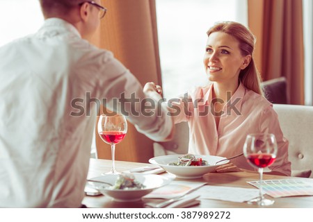 https://thumb9.shutterstock.com/display_pic_with_logo/2181548/387989272/stock-photo-handshake-of-young-business-man-and-woman-during-business-meeting-at-the-restaurant-387989272.jpg