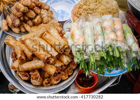 Asian street food. Traditional spring rolls in vietnamese night market