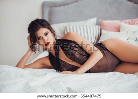 on poses Seductive bed lingerie