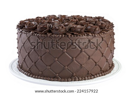 Triple Chocolate Cake frosted and embossed with diamond impression on the sides with hand crafted Chocolate frosting roses on top Isolated on White Background - stock photo