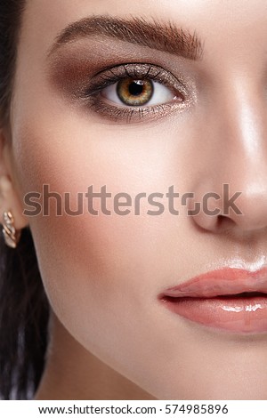 Half face female beauty portrait with day beauty makeup